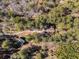 Aerial view of house nestled in a wooded area at 5275 Johnson Spur, Loganville, GA 30052