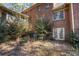 Brick home showcasing a back view with access to the backyard at 5275 Johnson Spur, Loganville, GA 30052