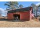 Red barn with open bay doors, offering ample storage space at 5275 Johnson Spur, Loganville, GA 30052