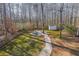 Large backyard with firepit, shed, and walking path at 5955 Shannon Dr, Cumming, GA 30040