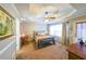 Primary bedroom with tray ceiling and ceiling fan at 5955 Shannon Dr, Cumming, GA 30040