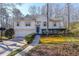 Two-story house with attached garage and manicured lawn at 5955 Shannon Dr, Cumming, GA 30040