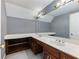 Bathroom with double vanity and patterned wallpaper at 2402 Highway 138 Sw, Conyers, GA 30094
