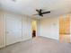 Bedroom with ensuite bathroom and ceiling fan at 2402 Highway 138 Sw, Conyers, GA 30094