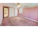 Bright bedroom featuring double closets and carpeting at 2402 Highway 138 Sw, Conyers, GA 30094
