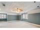 Large bedroom with striped wallpaper and ceiling fan at 2402 Highway 138 Sw, Conyers, GA 30094