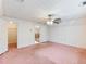 Bedroom with ceiling fan and pink carpet at 2402 Highway 138 Sw, Conyers, GA 30094