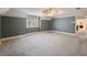 Bedroom with blue striped wallpaper and large window at 2402 Highway 138 Sw, Conyers, GA 30094
