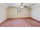 Bedroom with ceiling fan and pink carpet at 2402 Highway 138 Sw, Conyers, GA 30094