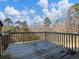 Wooden deck overlooks private wooded area and inground pool at 2402 Highway 138 Sw, Conyers, GA 30094