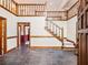 Two-story foyer with slate flooring and wooden staircase at 2402 Highway 138 Sw, Conyers, GA 30094