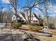 Brick home with a large backyard, surrounded by mature trees at 2402 Highway 138 Sw, Conyers, GA 30094