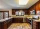 U-shaped kitchen, stainless steel appliances, and tiled floor at 2402 Highway 138 Sw, Conyers, GA 30094