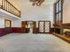 Two story living room with fireplace and balcony overlook at 2402 Highway 138 Sw, Conyers, GA 30094