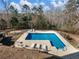 Elevated view of refreshing in-ground pool with lounge chairs at 2402 Highway 138 Sw, Conyers, GA 30094