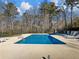 Inviting rectangular pool with lounge chairs, ready for summer fun at 2402 Highway 138 Sw, Conyers, GA 30094