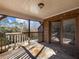 Screened porch with flagstone floor and wooded views at 2402 Highway 138 Sw, Conyers, GA 30094
