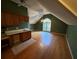 Bright bonus room featuring hardwood floors and a large window at 4342 White Surrey Nw Dr, Kennesaw, GA 30144