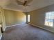 Spacious main bedroom with large windows and carpet at 4342 White Surrey Nw Dr, Kennesaw, GA 30144