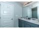 Elegant bathroom with double vanity and gray cabinets at 8140 Highland Dr, Covington, GA 30014