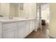 Double vanity bathroom with a view into a bedroom at 97 Bridge View Dr, Marietta, GA 30066