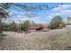 House sits on a large lot with a wooded area at 4055 Thaxton Rd, Atlanta, GA 30349