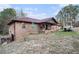 Brick ranch house with a large yard and attached garage at 4055 Thaxton Rd, Atlanta, GA 30349