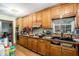 Long kitchen with wood cabinets and granite countertops at 4055 Thaxton Rd, Atlanta, GA 30349