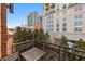 Private balcony with city views and small table and chairs at 1058 Piedmont Ne Ave # 302, Atlanta, GA 30309