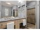 Large bathroom with double vanity, shower, and linen closet at 1058 Piedmont Ne Ave # 302, Atlanta, GA 30309