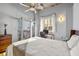 Sunlit bedroom with a private balcony, a desk for working, and a large window overlooking the city at 1058 Piedmont Ne Ave # 302, Atlanta, GA 30309