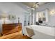 Bright bedroom with hardwood floors, a ceiling fan, and access to a balcony at 1058 Piedmont Ne Ave # 302, Atlanta, GA 30309