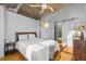 Spacious bedroom with hardwood floors and sliding barn door to bathroom at 1058 Piedmont Ne Ave # 302, Atlanta, GA 30309