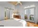 Bright bedroom showcasing a private balcony with french doors, closet with sliding door, and an ensuite bathroom at 1058 Piedmont Ne Ave # 302, Atlanta, GA 30309