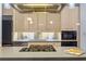 Contemporary kitchen with stainless appliances, light wood cabinets, and gas cooktop on island at 1058 Piedmont Ne Ave # 302, Atlanta, GA 30309