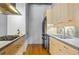 Modern kitchen with stainless steel appliances and light wood cabinets at 1058 Piedmont Ne Ave # 302, Atlanta, GA 30309
