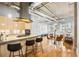 Open concept kitchen and living area with hardwood floors and modern appliances at 1058 Piedmont Ne Ave # 302, Atlanta, GA 30309