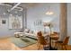 Stylish living room with hardwood floors, industrial-style concrete ceiling, and modern lighting at 1058 Piedmont Ne Ave # 302, Atlanta, GA 30309