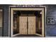 Restaurant entrance with modern wood and metal doors at 1058 Piedmont Ne Ave # 302, Atlanta, GA 30309