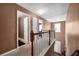 Upstairs hallway with doors to bedrooms at 512 Quinn Dr, Woodstock, GA 30188