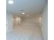 Large bonus room with carpeted floor and multiple access points at 131 Wards Crossing Way # 19, Johns Creek, GA 30022