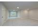 Spacious bonus room with gray walls and carpeted floor at 131 Wards Crossing Way # 19, Johns Creek, GA 30022