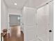 Upstairs hallway with linen closet and doors to bedrooms at 131 Wards Crossing Way # 19, Johns Creek, GA 30022
