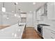 Modern kitchen with white cabinets, a large island, and stainless steel appliances at 131 Wards Crossing Way # 19, Johns Creek, GA 30022