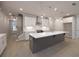 Modern kitchen with white cabinets, a large island, and stainless steel appliances at 131 Wards Crossing Way # 19, Johns Creek, GA 30022