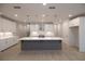 Spacious kitchen with white cabinets, quartz countertops, and large island at 131 Wards Crossing Way # 19, Johns Creek, GA 30022