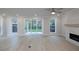Spacious living room with hardwood floors, fireplace and sliding glass doors to backyard at 131 Wards Crossing Way # 19, Johns Creek, GA 30022