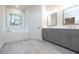 Main bathroom with double vanity, soaking tub, and gray cabinets at 131 Wards Crossing Way # 19, Johns Creek, GA 30022