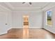 Main bedroom with hardwood floors and door to en-suite bathroom at 131 Wards Crossing Way # 19, Johns Creek, GA 30022