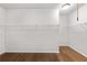 Large walk-in closet with wire shelving and hardwood floors at 131 Wards Crossing Way # 19, Johns Creek, GA 30022
